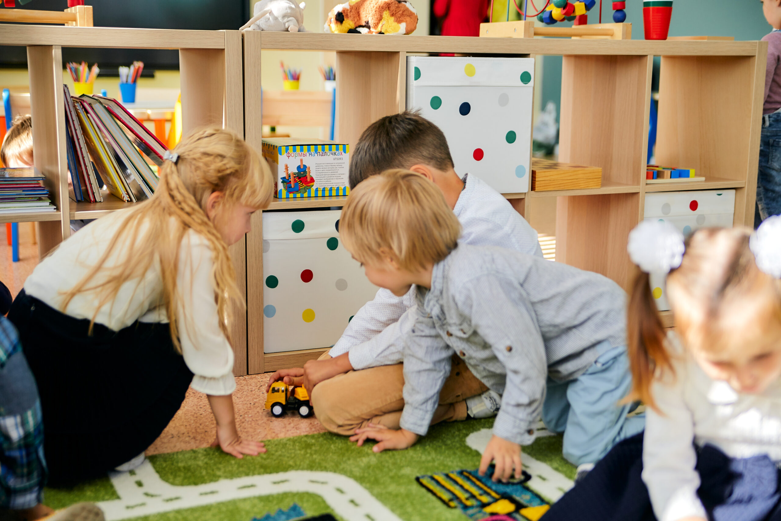 Children playing and learning in a stimulating kindergarten room