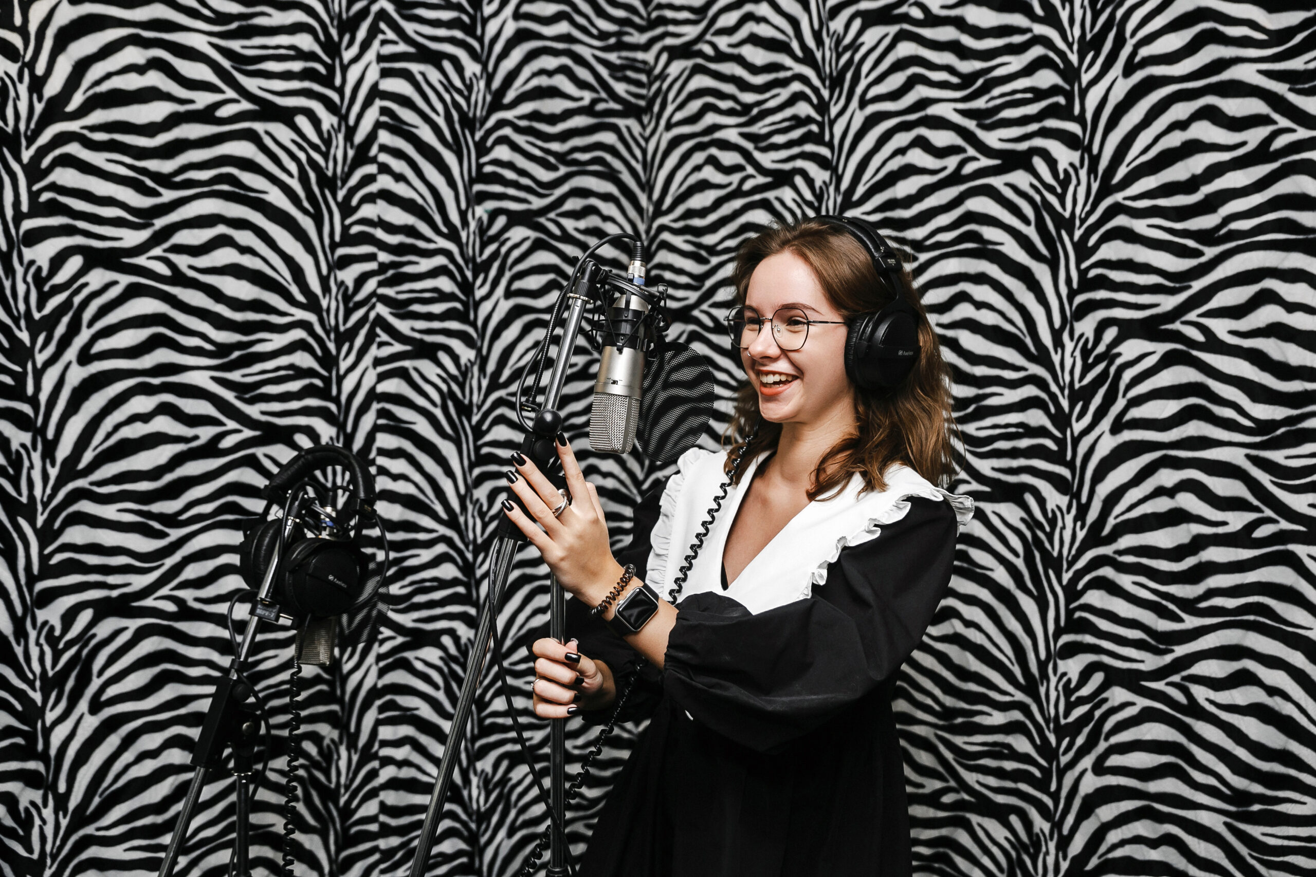 Student singing in a recording studio during vocal class